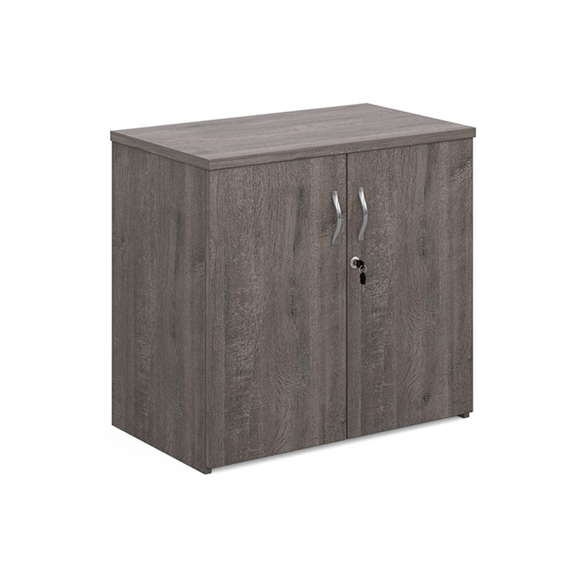 A wooden cupboard with grey finish, featuring a pair of lockable doors with silver handles and a solid back panel.