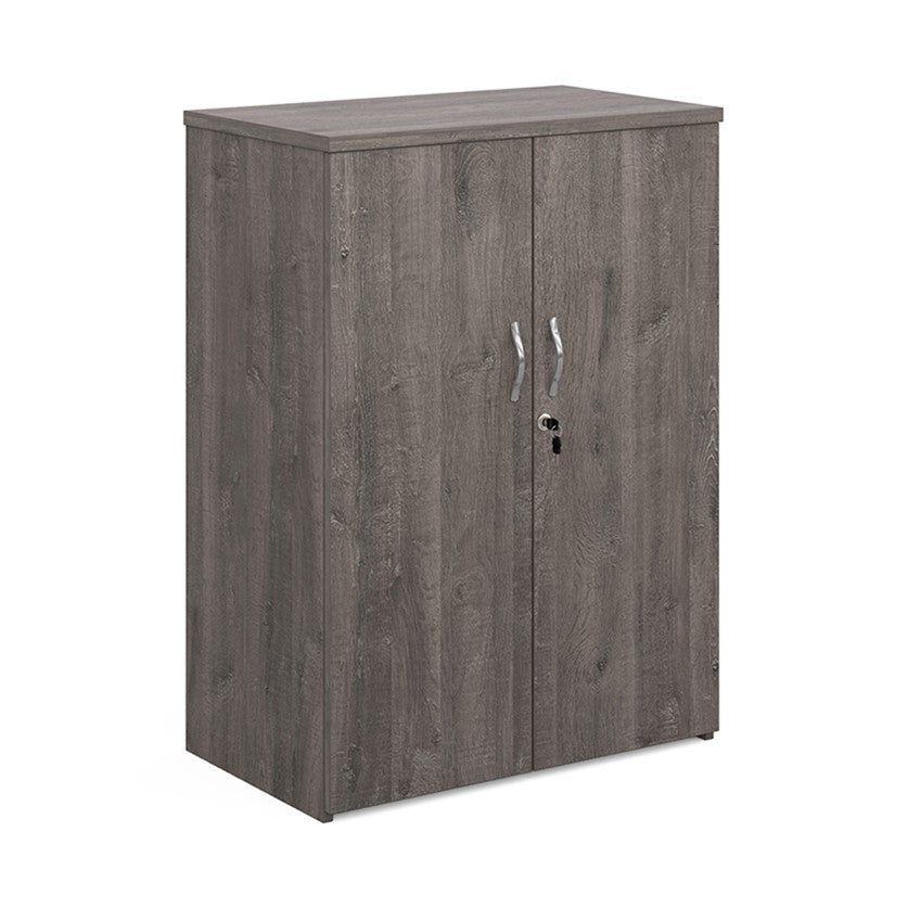 A wooden cupboard with be grey finish, featuring a pair of lockable doors with silver handles and a solid back panel.