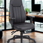black office chair in a modern office setting with large windows.