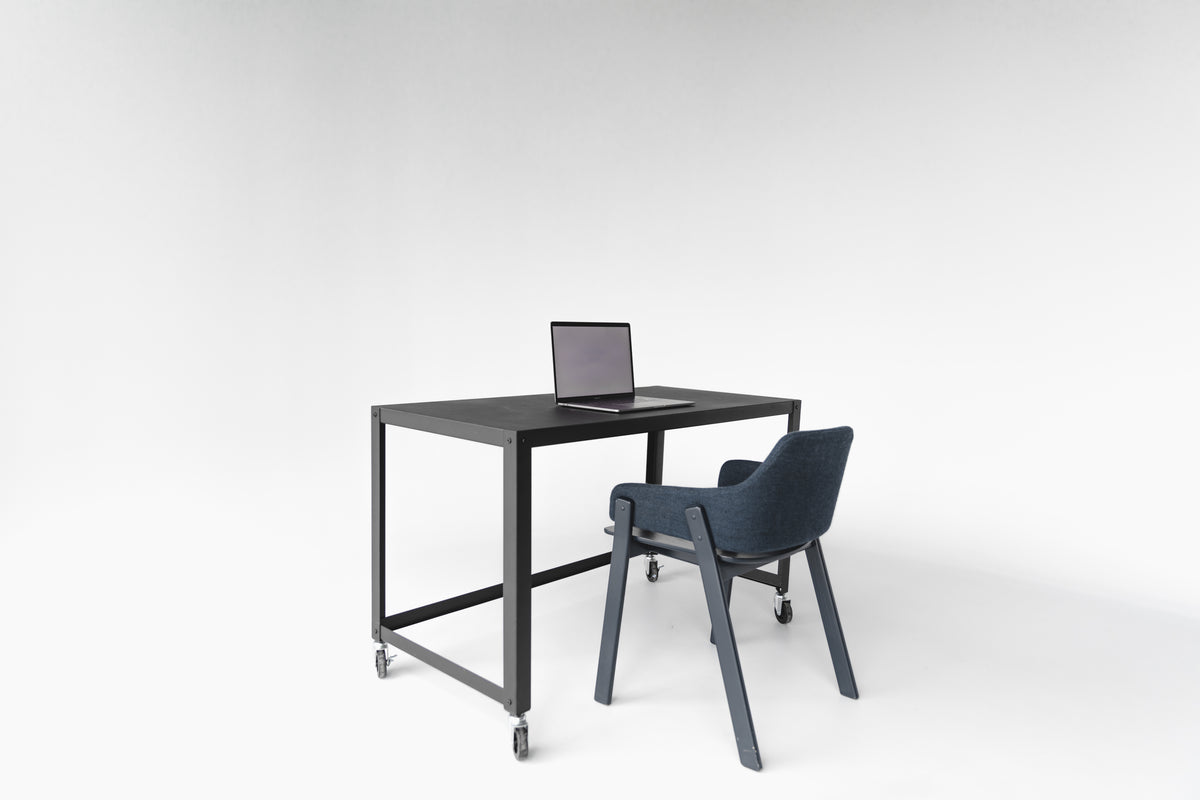 Ergonomic office chair at a clean desk setup, angled view, from the Chilli Seating office chair range